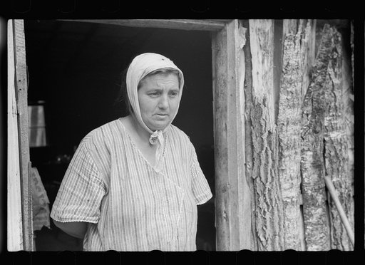 Mrs. Howard, who lives with her daughter in one-room cabin they built themselves, Aitkin County, Minnesota