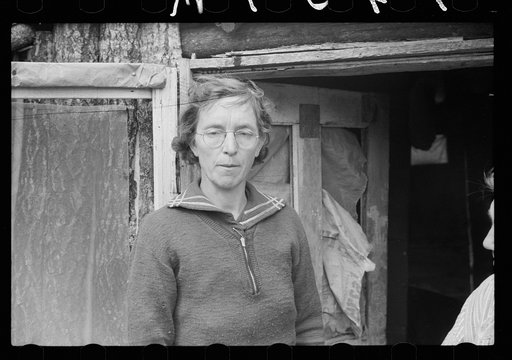 Woman living on cut-over, burnt-over farmland, Aitkin County, Minnesota