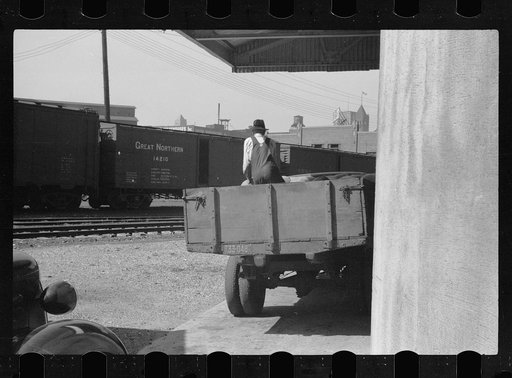 Untitled photo, possibly related to: Unloading sacks of wheat at elevator, Minneapolis, Minnesota