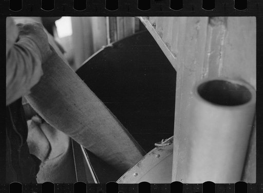 Untitled photo, possibly related to: Truck unloading sacks of wheat at elevator. Most grain is delivered to city elevators by freight train. Minneapolis, Minnesota