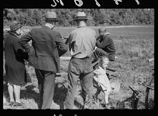 Untitled photo, possibly related to: Farmers looking over sled at auction near Tenstrike, Minnesota