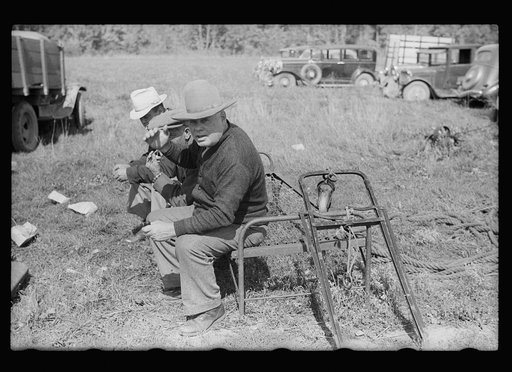 Untitled photo, possibly related to: Farmers looking over sled at auction near Tenstrike, Minnesota