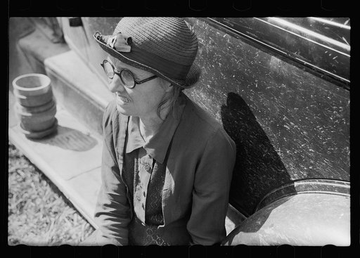 Untitled photo, possibly related to: Farm woman waiting for her husband. Auction near Tenstrike, Minnesota