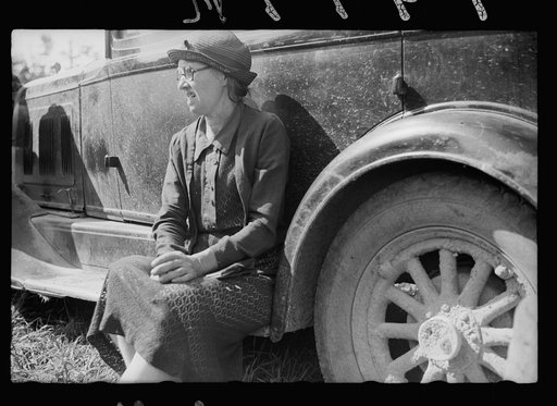 Untitled photo, possibly related to: Farm woman waiting for her husband. Auction near Tenstrike, Minnesota
