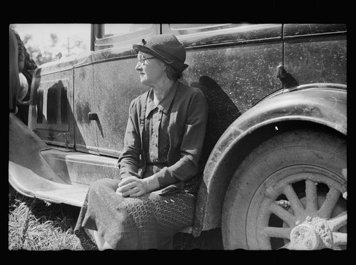 Farm woman waiting for her husband. Auction near Tenstrike, Minnesota