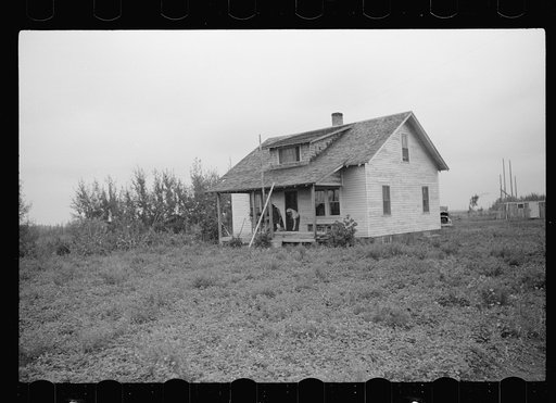 Untitled photo, possibly related to: Farmer and son, rehabilitation clients, building barn which FSA (Farm Security Administration) loan enables them to build, Lake of the Woods County, Minnesota