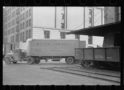 Untitled photo, possibly related to: Family of trucker waiting while truck is being loaded, Minneapolis, Minnesota