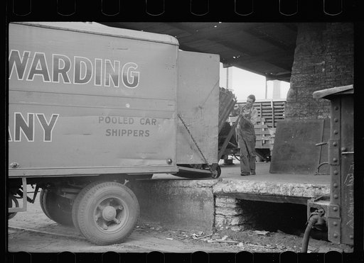 Untitled photo, possibly related to: Family of trucker waiting while truck is being loaded, Minneapolis, Minnesota