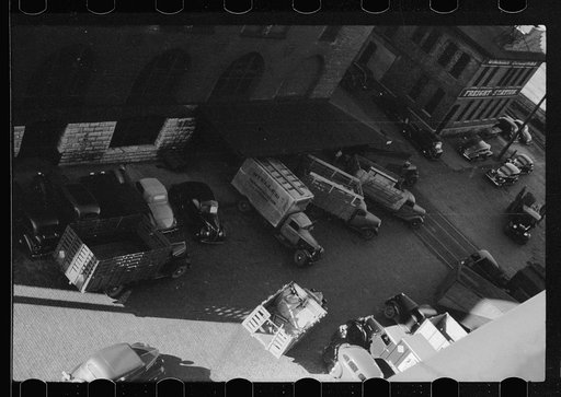 Untitled photo, possibly related to: Trucks loading at farm implement warehouse, Minneapolis, Minnesota