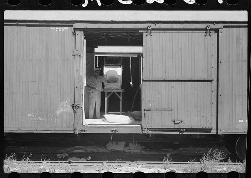 Loading freight car with sacks of flour, Minneapolis, Minnesota