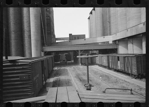 Untitled photo, possibly related to: Freight car and flour mill, Minneapolis, Minnesota