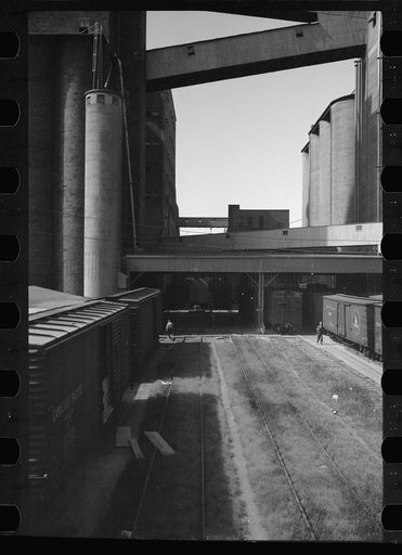 Untitled photo, possibly related to: Freight car and flour mill, Minneapolis, Minnesota