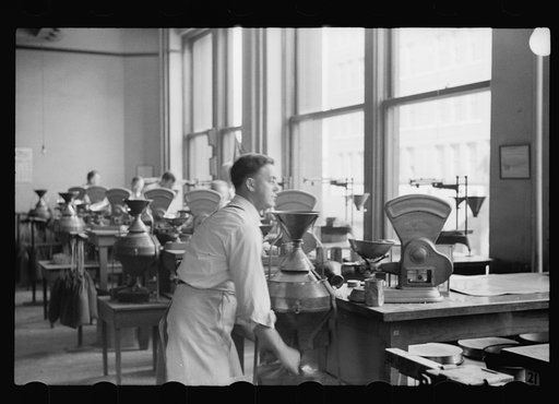 Untitled photo, possibly related to: Testing for impurities in wheat at Minnesota grain inspection dept., Minneapolis, Minnesota