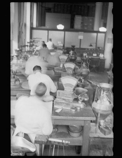Untitled photo, possibly related to: Testing for impurities in wheat at Minnesota grain inspection dept., Minneapolis, Minnesota