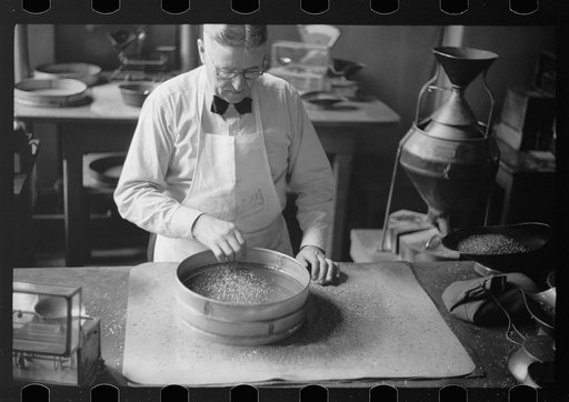 Untitled photo, possibly related to: Testing for impurities in wheat at Minnesota grain inspection dept., Minneapolis, Minnesota