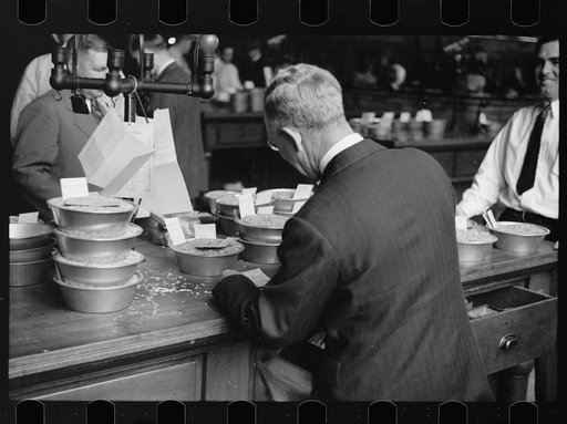 Untitled photo, possibly related to: Buyer examining sample of oats at open market, Minneapolis Grain Exchange, Minnesota