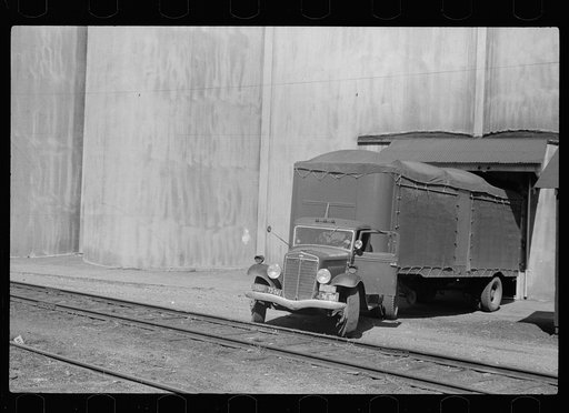 Truck unloading wheat at grain elevator, Minneapolis, Minnesota