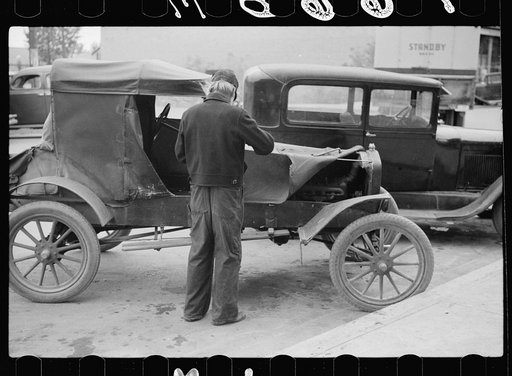 Farmer with 1913 model Ford on main street of Sisseton, South Dakota