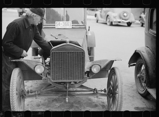 Untitled photo, possibly related to: Farmer with 1913 model Ford on main street of Sisseton, South Dakota
