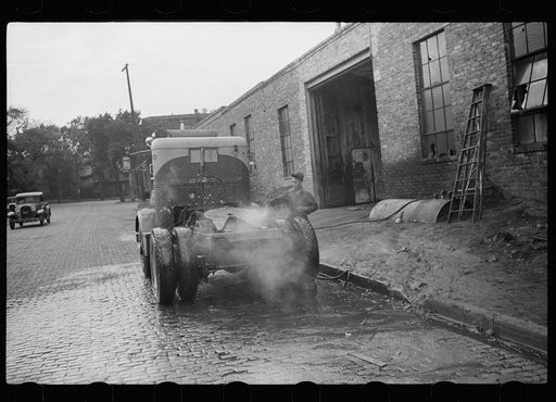 Untitled photo, possibly related to: Washing truck chassis before sending to garage for overhauling. Minneapolis, Minnesota