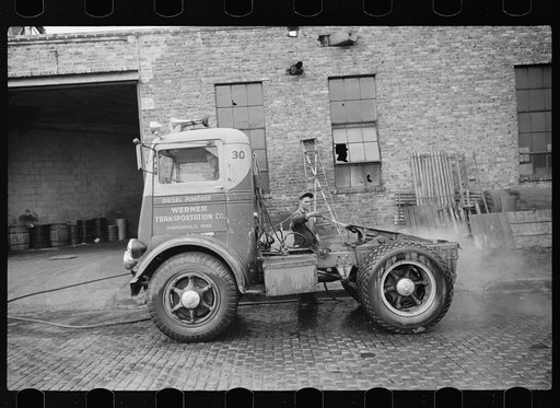 Washing truck chassis before sending to garage for overhauling. Minneapolis, Minnesota