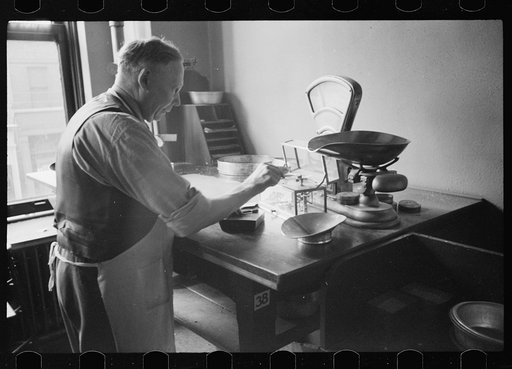 Untitled photo, possibly related to: Grain inspector at state grain inspection deptartment, Minneapolis, Minnesota