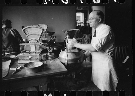 Untitled photo, possibly related to: Grain inspector at state grain inspection deptartment, Minneapolis, Minnesota