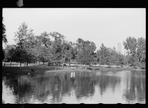Untitled photo, possibly related to: Small family feeding ducks in park on Saturday afternoon, Minneapolis, Minnesota