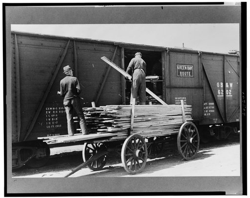 Unloading lumber at sash and door mill, Dubuque, Iowa