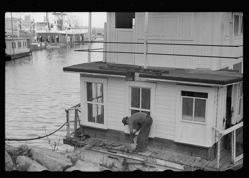 Untitled photo, possibly related to: Attaching propeller to river boat, Dubuque, Iowa