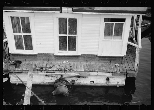 Untitled photo, possibly related to: Attaching propeller to river boat, Dubuque, Iowa