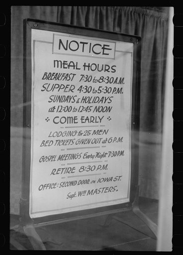 Sign in window of city mission, Dubuque, Iowa