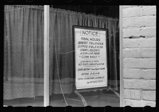 Untitled photo, possibly related to: Sign in window of city mission, Dubuque, Iowa