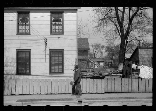 Untitled photo, possibly related to: Workman going home, Dubuque, Iowa