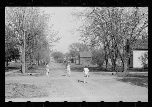 Untitled photo, possibly related to: Children playing in the street, Woodbine Iowa