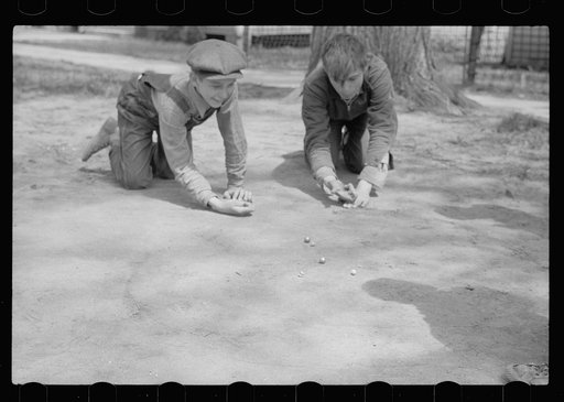 Untitled photo, possibly related to: Boys playing marbles, Woodbine, Iowa