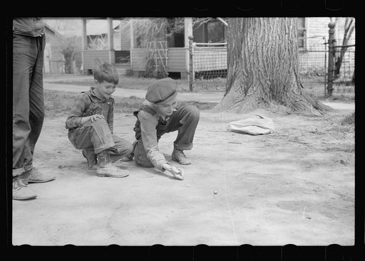 Shooting marbles, Woodbine, Iowa