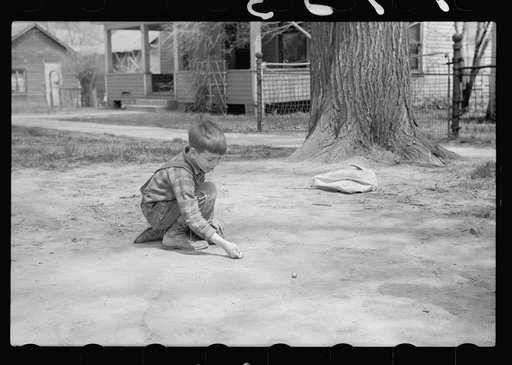 Shooting marbles, Woodbine, Iowa