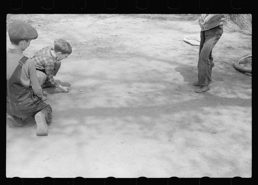Untitled photo, possibly related to: Boys playing marbles, Woodbine, Iowa
