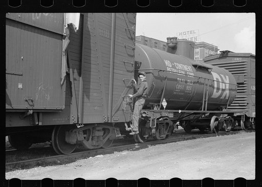 Untitled photo, possibly related to: Boy hopping freight train, Dubuque, Iowa