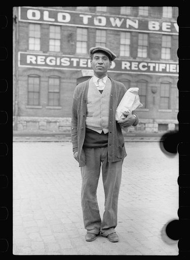 Untitled photo, possibly related to: Negro waiting for freight train to leave Dubuque, Iowa