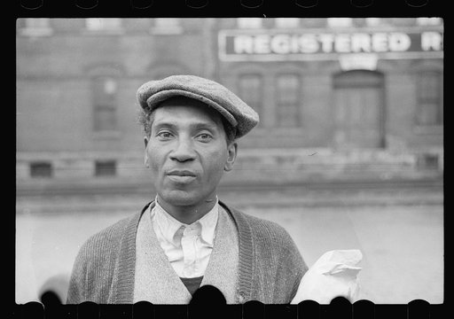Negro waiting for freight train to leave Dubuque, Iowa