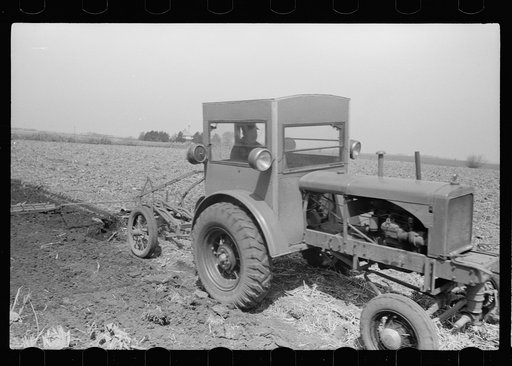 Untitled photo, possibly related to: Plowing and harrowing in tractor with cab, Grundy County, Iowa