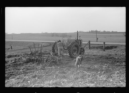 Untitled photo, possibly related to: Detaching disc from tractor at end of day's work, Grundy County, Iowa