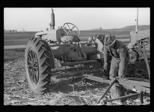 Untitled photo, possibly related to: Detaching disc from tractor at end of day's work, Grundy County, Iowa