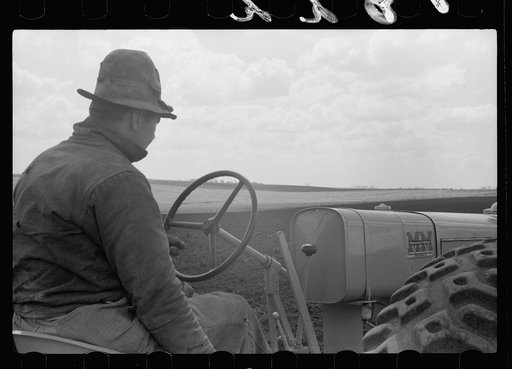 Untitled photo, possibly related to: Boy operating tractor, Grundy County, Iowa