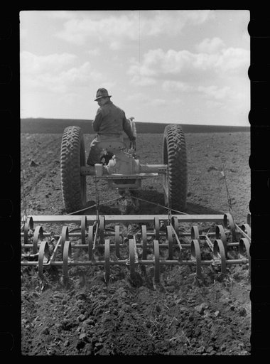 Untitled photo, possibly related to: Boy operating tractor, Grundy County, Iowa