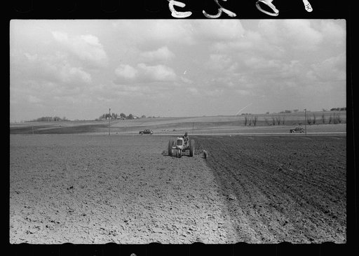 Untitled photo, possibly related to: Boy operating tractor, Grundy County, Iowa
