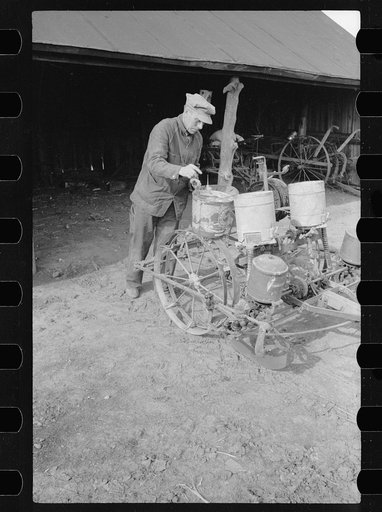 Untitled photo, possibly related to: Oiling planter preparatory to corn planting, Jasper County, Iowa