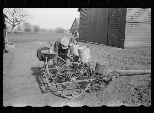 Untitled photo, possibly related to: Oiling planter preparatory to corn planting, Jasper County, Iowa